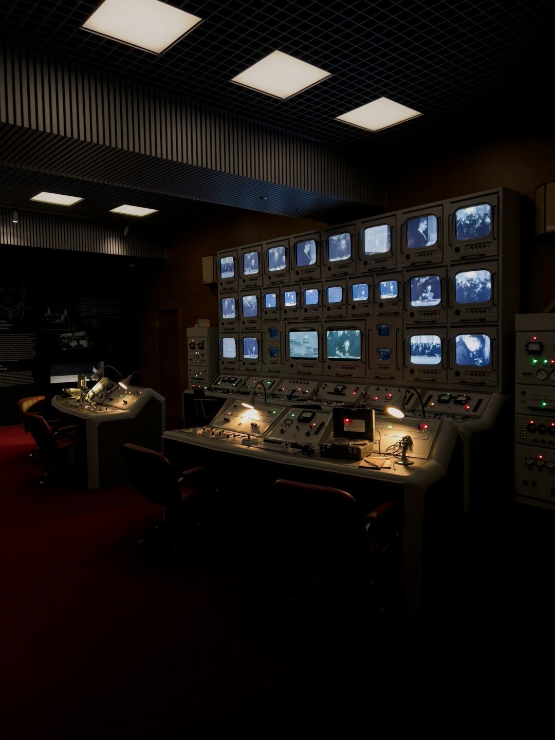 Industrial control room with monitoring screens, the kind of setup that supports predictive maintenance for hydraulic hoses in modern plants