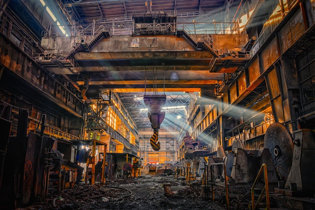 Interior of a steel mill where heat-resistant steel plant hoses and hydraulic hoses operate in extreme conditions